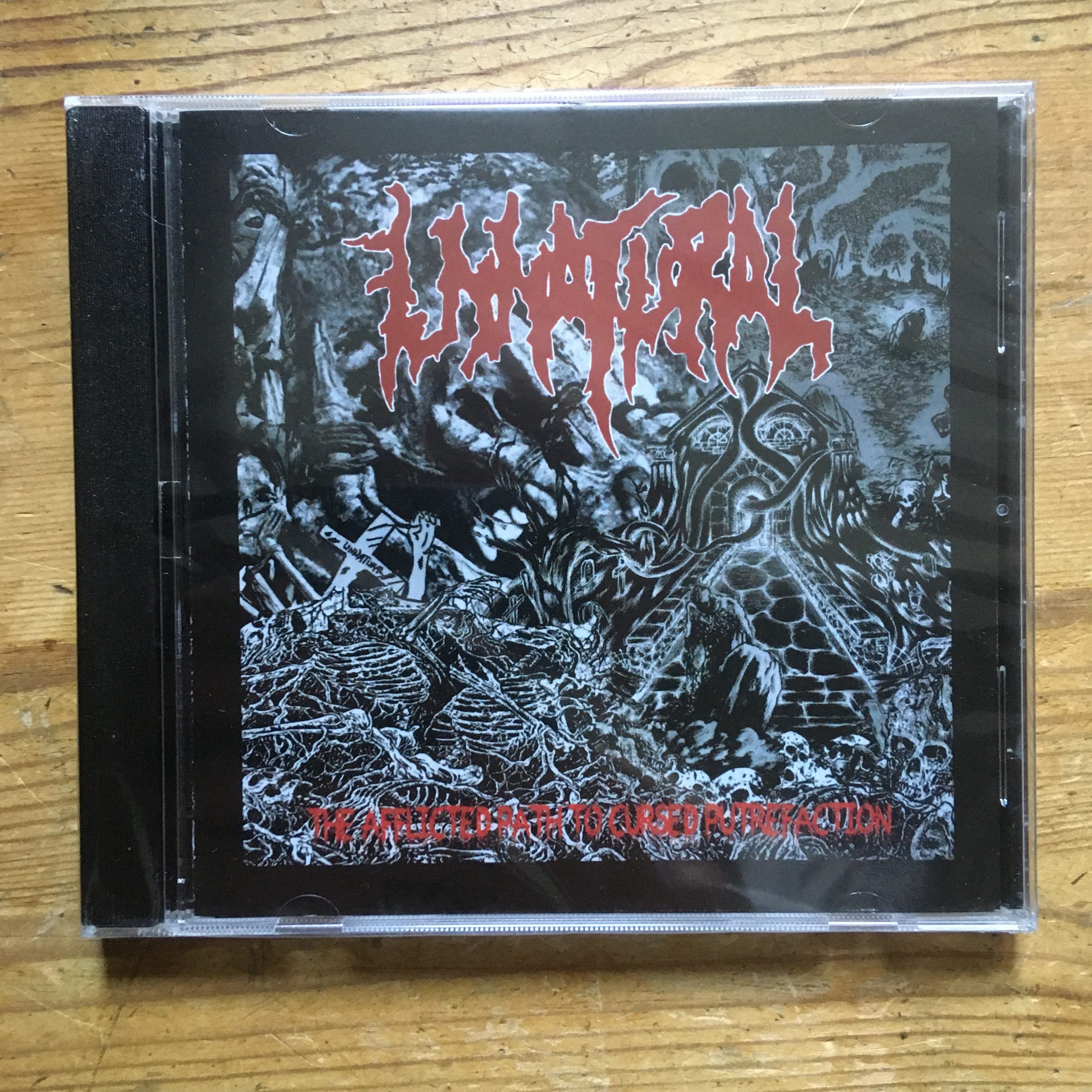 Photo of the Unnatural - "The Afflicted Path to Cursed Putrefaction Compilation" CD